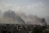 (240528) -- RAFAH, May 28, 2024 (Xinhua) -- Smoke rises in Rafah city in the southern Gaza Strip, May 28, 2024. The Israeli army on Tuesday advanced into the heart of Rafah city in the southern Gaza Strip, amid clashes with Palestinian militants, according to Palestinian security sources and eyewitnesses. Security sources told Xinhua that Israeli tanks and Israeli army forces reached the city center amid heavy gunfire and airstrikes covering up the ground incursion. (Photo by Khaled Omar/Xinhua