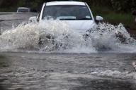(240529) -- COLOMBO, May 29, 2024 (Xinhua) -- A car plows through a flooded road in Gampaha, Sri Lanka, on May 28, 2024. Sri Lankan President Ranil Wickremesinghe has directed officials to deliver immediate relief to those impacted by the adverse weather conditions as heavy rains and strong winds continued to lash out across the country, said the President