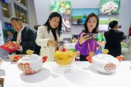 (240529) -- BEIJING/BRUSSELS, May 29, 2024 (Xinhua) -- Visitors take photos of exhibits at the China International Conference for the Cooperation on the Premium Geographical Indication Brands 2023 in Tangshan, north China