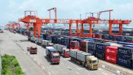 (240529) -- LIUZHOU, May 29, 2024 (Xinhua) -- A drone photo shows trucks transporting containers at a railway container terminal in Qinzhou, south China