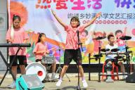 (240531) -- HENGYANG, May 31, 2024 (Xinhua) -- Band members stage a performance in Miaoxi Primary School in Goulou Town of Hengyang County, central China