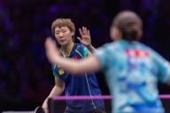 (240531) -- CHONGQING, May 31, 2024 (Xinhua) -- Wang Manyu (L) of China reacts while competing against Ito Mima of Japan during the women