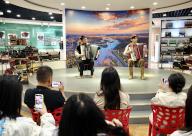 (240601) -- YINING, June 1, 2024 (Xinhua) -- Tourists enjoy a performance at an accordion museum on Liuxing Street in Yining City, Ili Kazak Autonomous Prefecture, northwest China