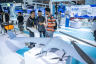 (240601) -- CHANGSHA, June 1, 2024 (Xinhua) -- People look at a fixed wing drone during the 13th Central China Investment and Trade Exposition (Expo Central China 2024) in Changsha, central China