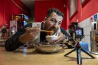 (240601) -- CHENGDU, June 1, 2024 (Xinhua) -- Iraqi food vlogger Ahmed Mohammed Jaber records a video at a local restaurant in Chengdu, southwest China