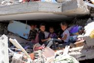 (240601) -- GAZA, June 1, 2024 (Xinhua) -- Palestinian children are seen among destroyed buildings in the southern Gaza Strip city of Khan Younis, May 31, 2024. (Photo by Rizek Abdeljawad\/Xinhua