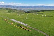 (240601) -- EMIN, June 1, 2024 (Xinhua) -- An aerial drone photo taken on May 30, 2024 shows a grassland scenic spot in Emin County, Tacheng Prefecture, northwest China