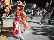 (240601) -- SHANTOU, June 1, 2024 (Xinhua) -- Zhuang Enqi (front) practices Yingge dance with a troupe in Yujiao Village of Guiyu Township, Shantou City, south China\'s Guangdong Province, May 29, 2024. The Yingge dance, or "dance to the hero\'s song," is a form of folk dance popular in south China\'s Guangdong Province that merges opera, dance, and martial arts. Dating back to the Ming Dynasty (1368-1644), this traditional dance is often performed during traditional Chinese festivals. The Yingge dance was listed as the first batch of national intangible cultural heritage in 2006. In April 2024, videos of a 5-year-old girl, Zhuang Enqi, performing the Yingge dance and interacting with a troupe of Yingge dancers garnered millions of views online. Enqi\'s father, Zhuang Rongqiang, is a drummer in a Yingge dance troupe in Yujiao Village. Enqi often went to the troupe\'s rehearsal venue with her father and developed a keen interest in the Yingge dance. Small drums, cymbals, serpent props, and Yingge sticks