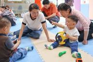 (240601) -- YICHANG, June 1, 2024 (Xinhua) -- Children exchange their toys during an activity at a Community Based Family Support (CBFS) center at the Jinxiu community of Xiling District, Yichang City of central China