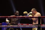 (240602) -- RIYADH, June 2, 2024 (Xinhua) -- Zhang Zhilei (R) of China fights with Deontay Wilder of the United States during the 5VS5 boxing event in Riyadh, Saudi Arabia, June 2, 2024. (Xinhua/Wang Haizhou