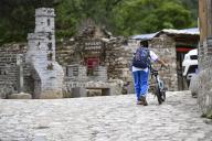 (240602) -- BEIJING, June 2, 2024 (Xinhua) -- A boy walks past the relic site of an ancient fort in Shixia Village in Yanqing District of Beijing, capital of China, May 31, 2024. Shixia Village in Yanqing District of Beijing was first built in the Ming Dynasty (1368-1644) and was once an important pass in the north of Juyongguan section of the Great Wall. The village, which is surrounded by mountains, has developed a tourism industry relying on the resources of the Great Wall in recent years and attracts visitors from all over the world. (Xinhua/Chen Zhonghao