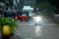(240602) -- KELANIYA, June 2, 2024 (Xinhua) -- Vehicles move through a flooded road in Kelaniya, Sri Lanka, on June 2, 2024. Sri Lanka