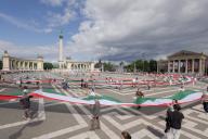 (240603) -- BUDAPEST, June 3, 2024 (Xinhua) -- People march with a 1,848-meter-long Hungarian flag to celebrate the Day of National Unity in Budapest, Hungary, on June 2, 2024. June 4 marks Hungary