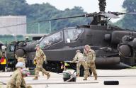 S. Korea-U.S. joint live-fire drill Soldiers from the U.S. 2nd Infantry Division load arms onto Apache choppers at the South Korean Navy