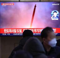 N. Korean missile news People watch a TV report about North Korea